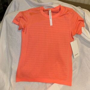 Lululemon Breeze By Short Sleeve Sz 4 In coral color NWT(m23)